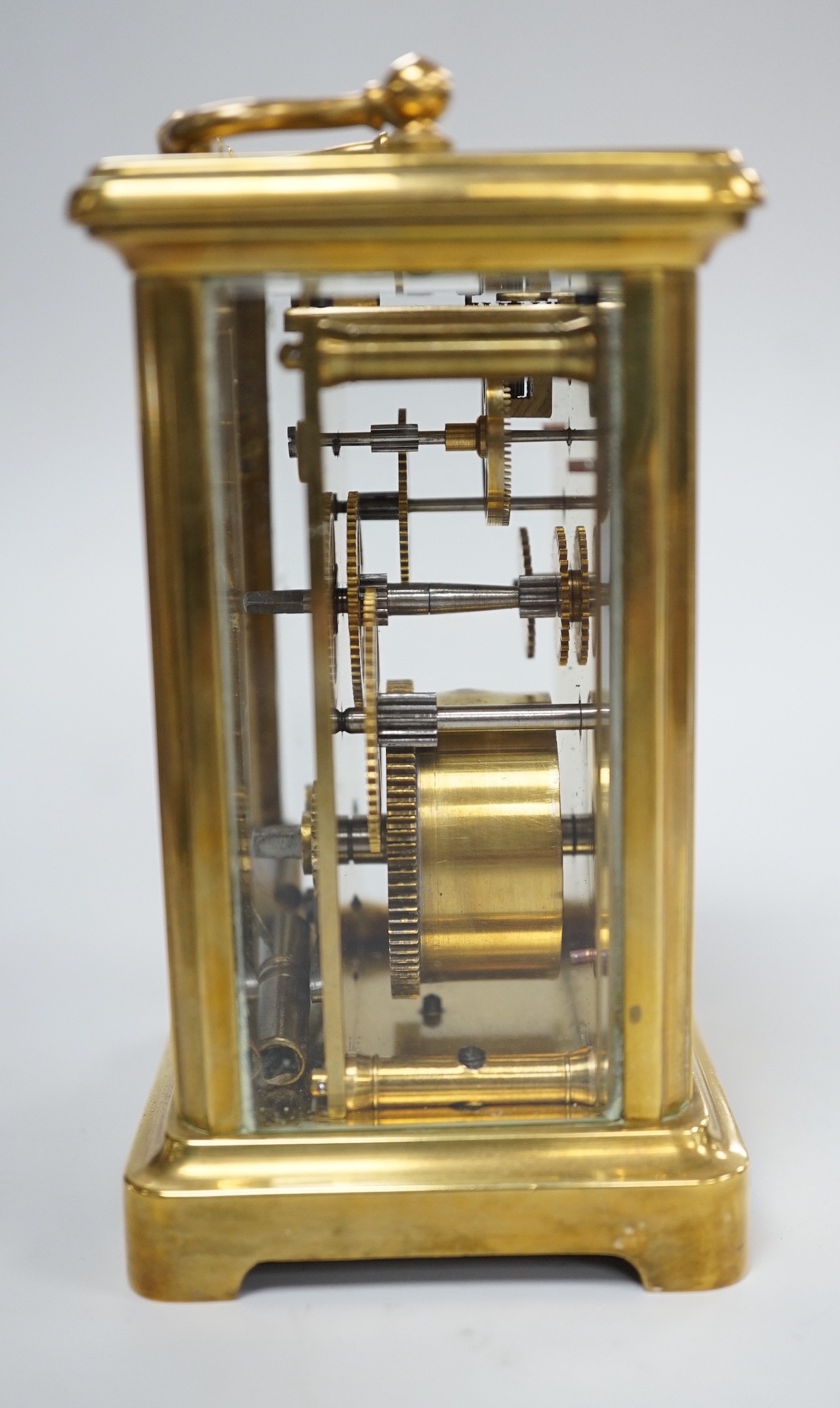 A brass cased carriage timepiece with key